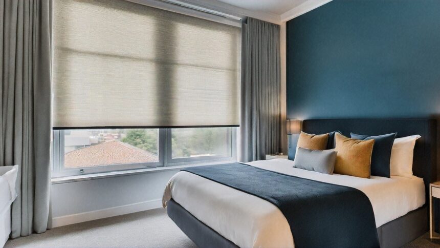 Bedroom with a roller blind showing the different types of roller blinds